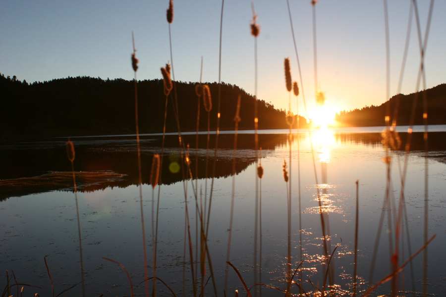 Sunrise on the lake on a clear day.