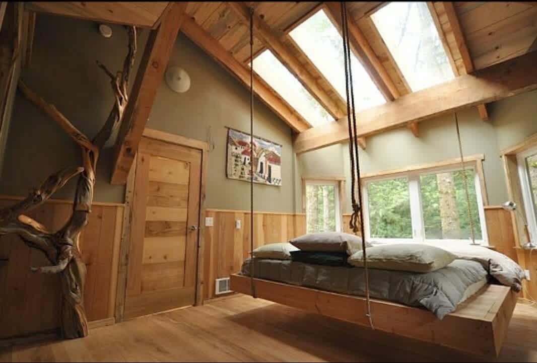 Hanging King Bed below skylights for indoor star viewing.
 