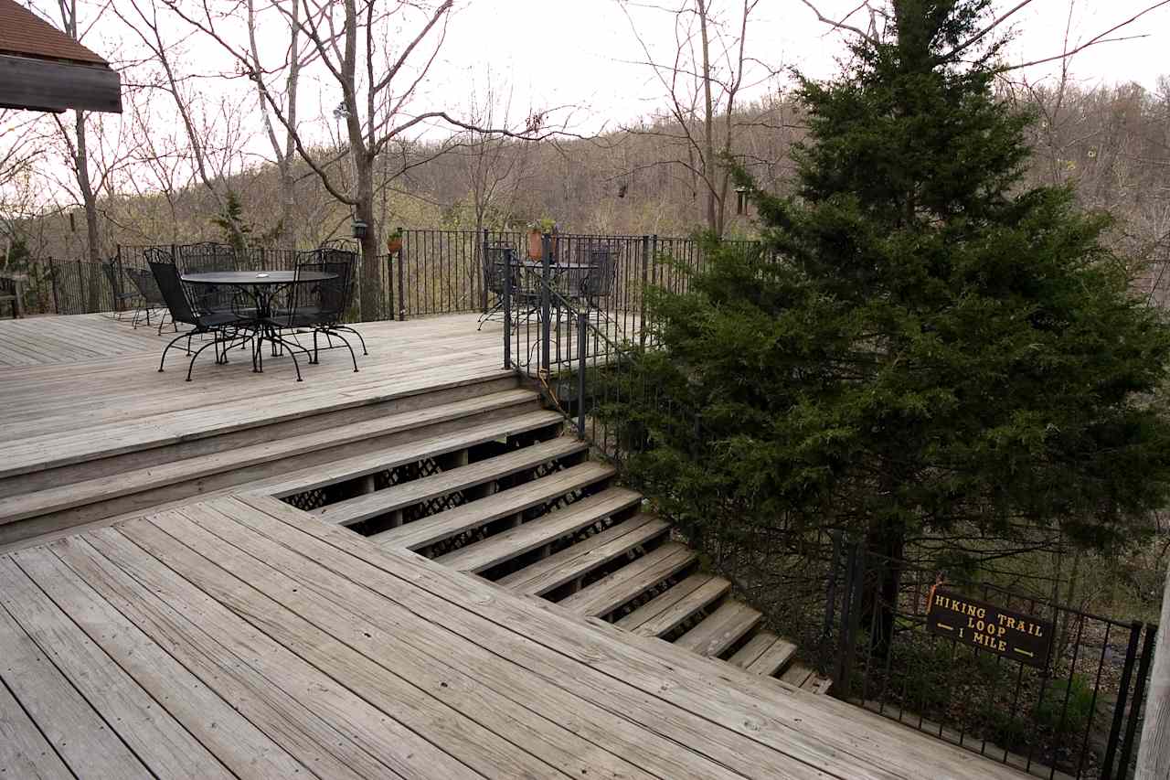 Azalea Falls Lodge deck overlooking the waterfall. 