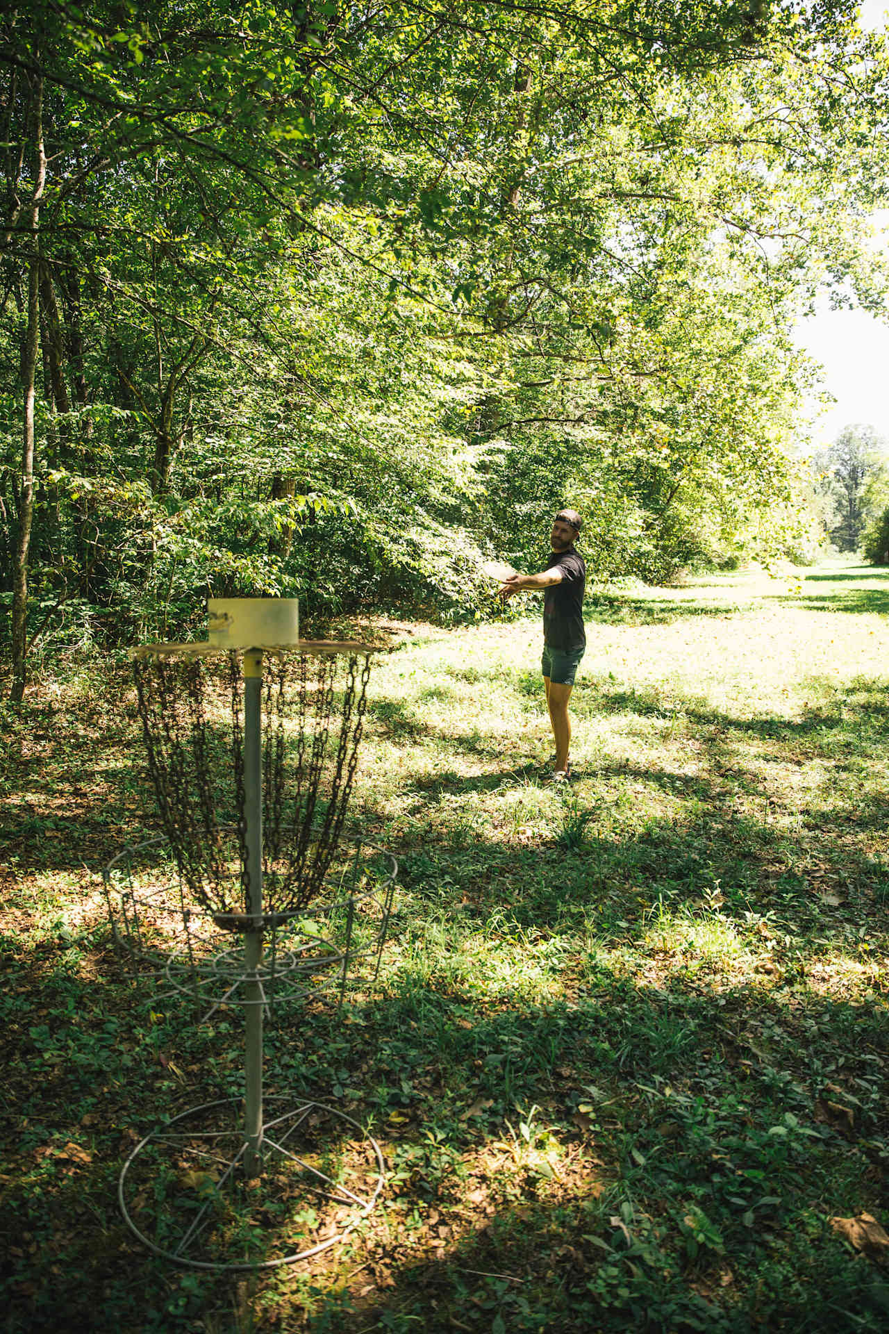 Disc golf along the field next to the trout stream