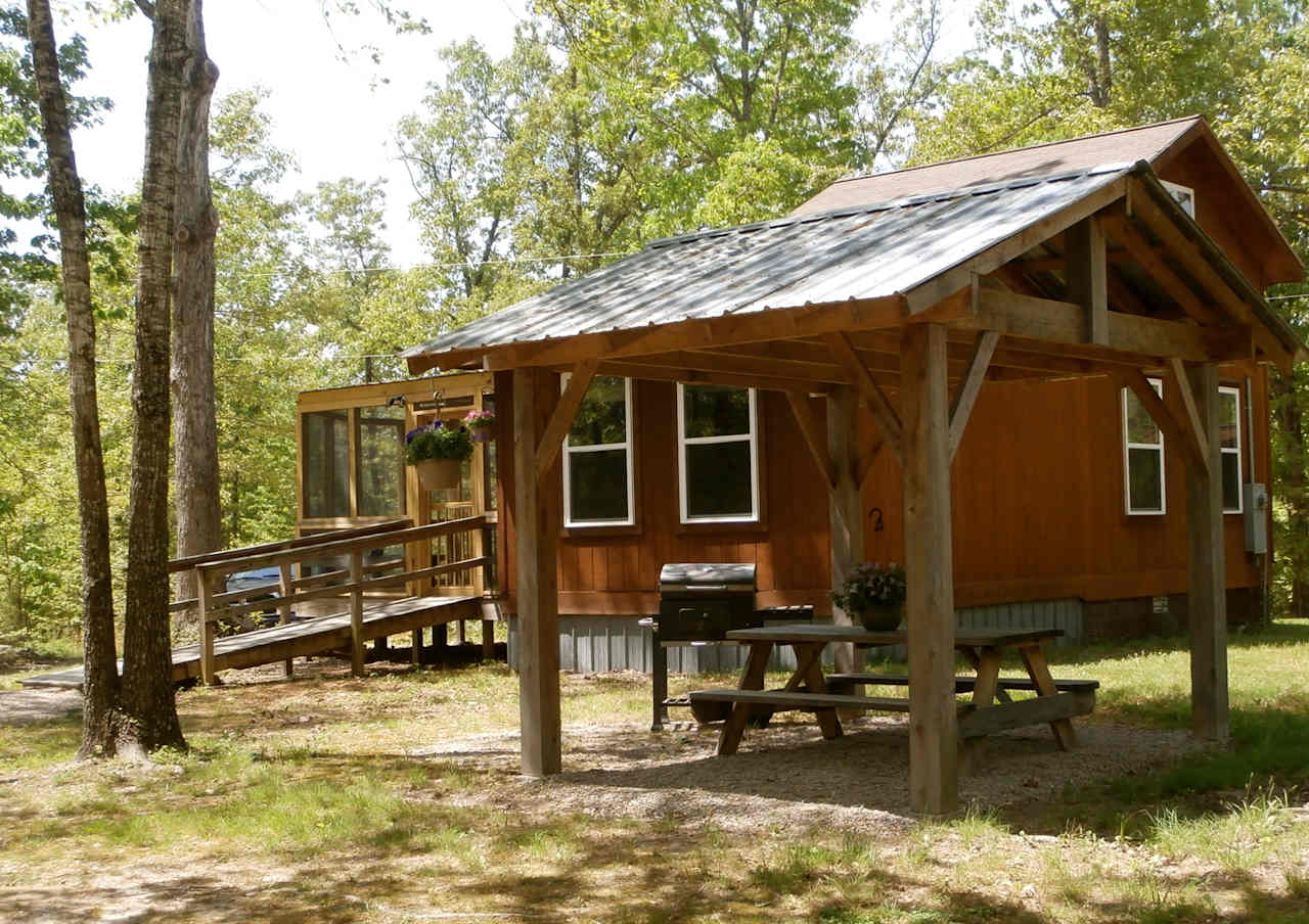 Guests enjoy days and evenings on the large screened porch.