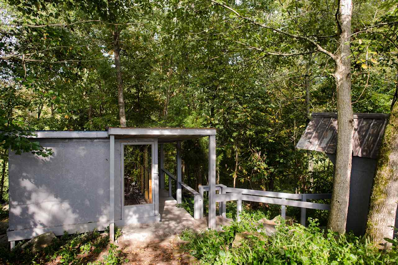 The Hawk's Nest is tucked down in the woods on the edge of a field.