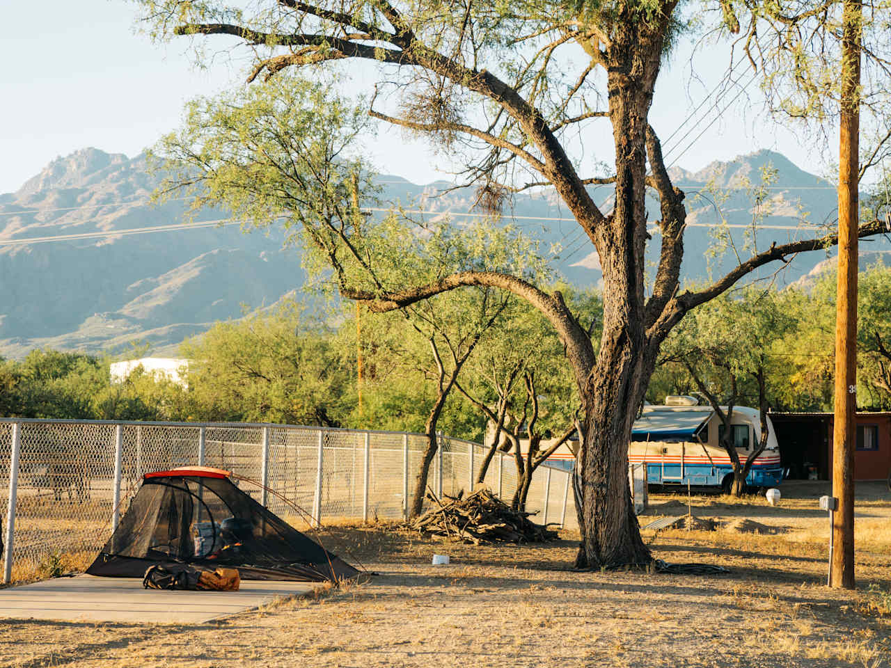 One site in the foreground, with another larger site back where the RV is parked