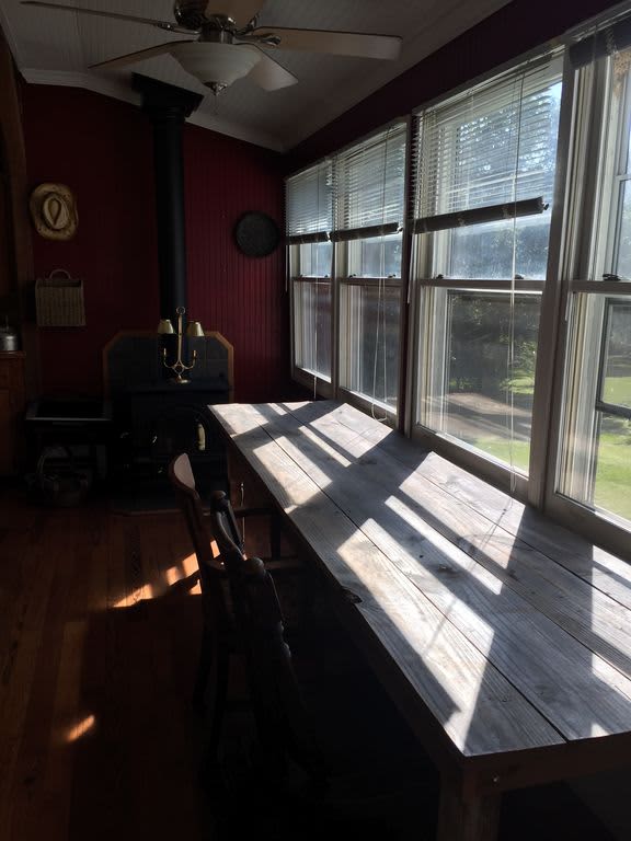 10' farm table in the big country kitchen with a woodburning stove.