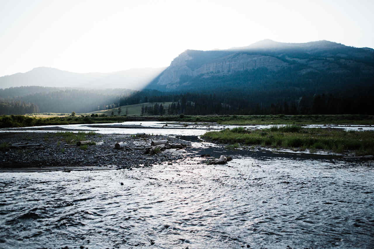 Light shining over the mountains surrounding Pebble Creek Campground.  Lamar Valley.