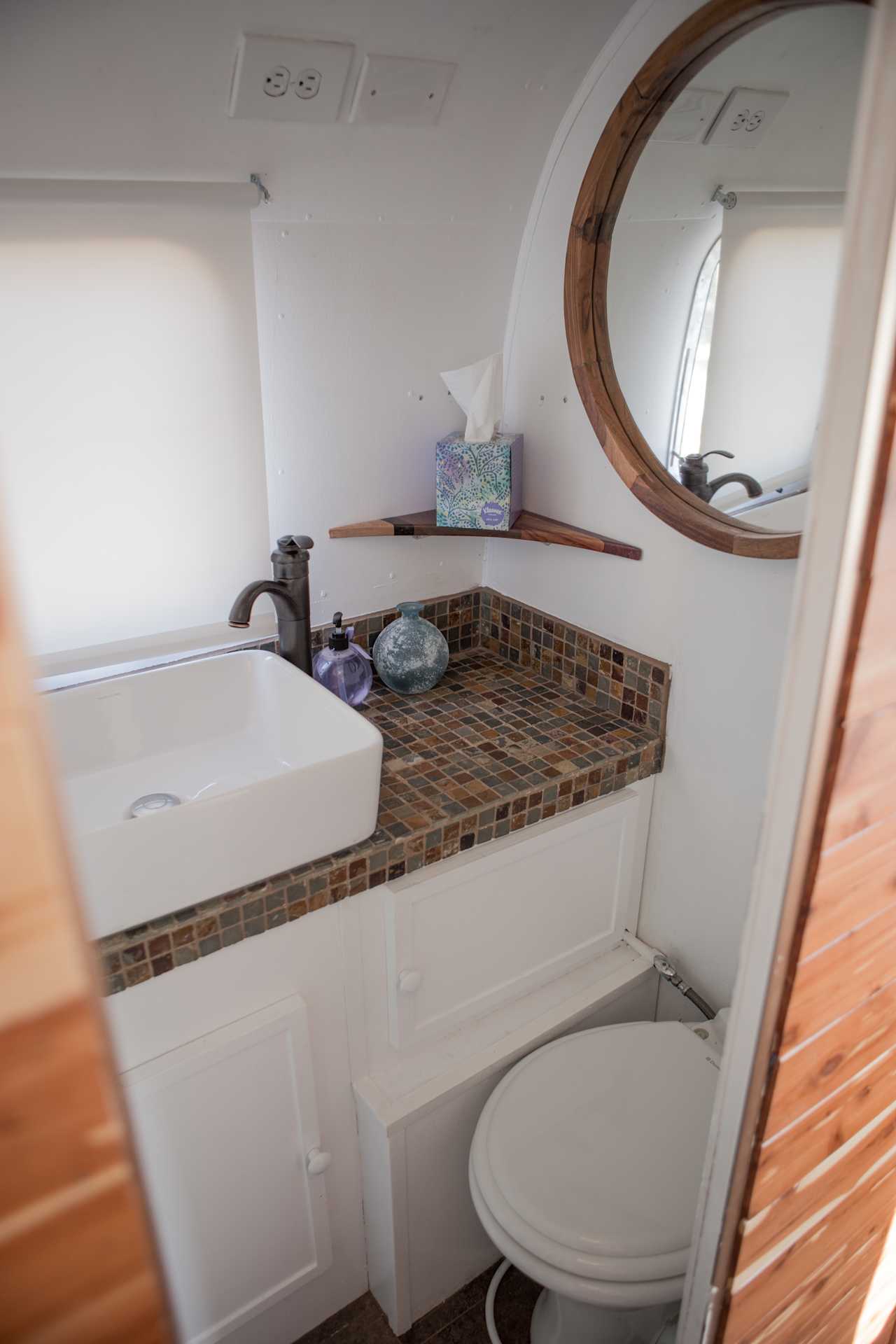 The bathroom in the camper, also has a shower in there!