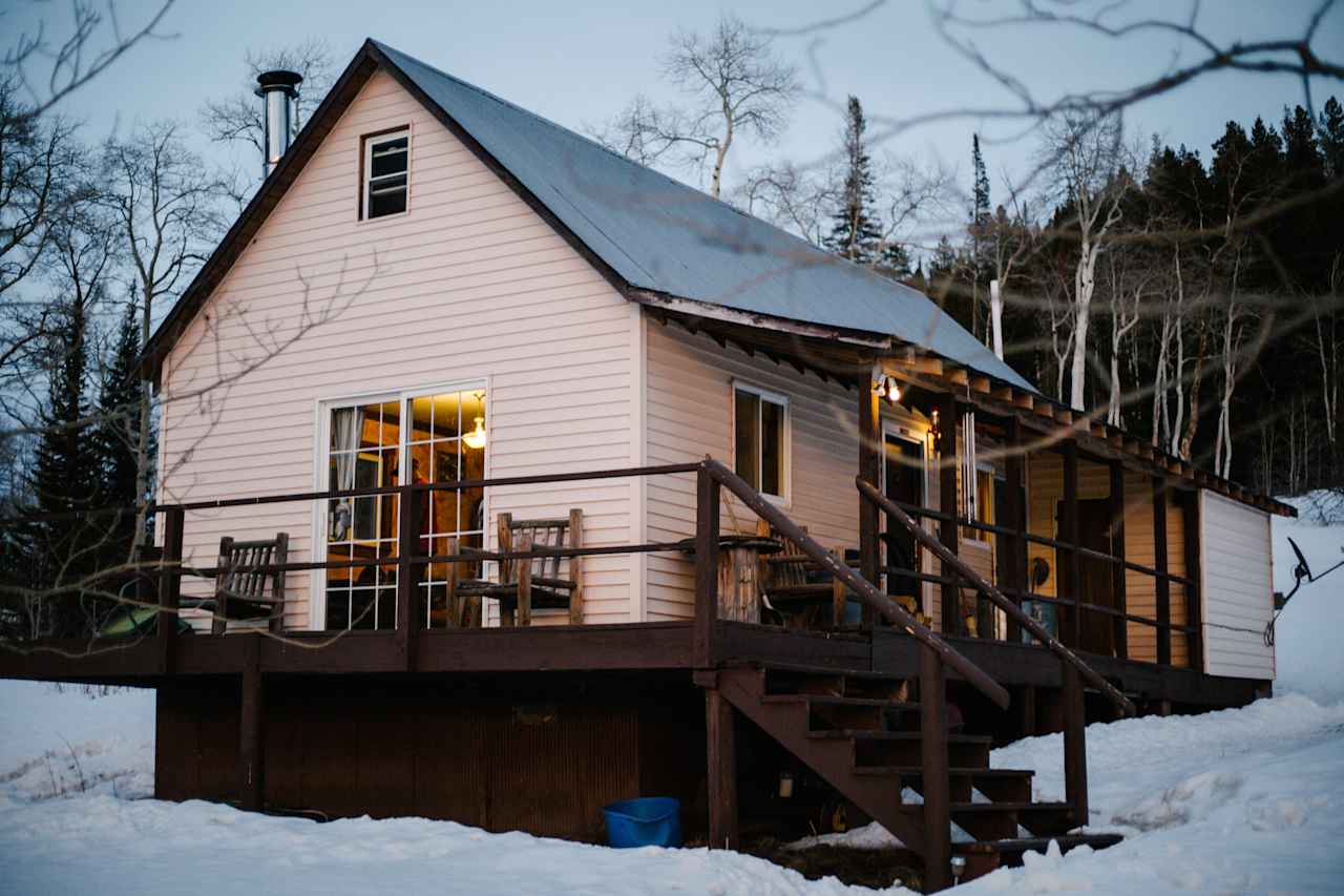 The view of the cabin right off the driveway. Be sure to bring a snow-capable vehicle in the winter!