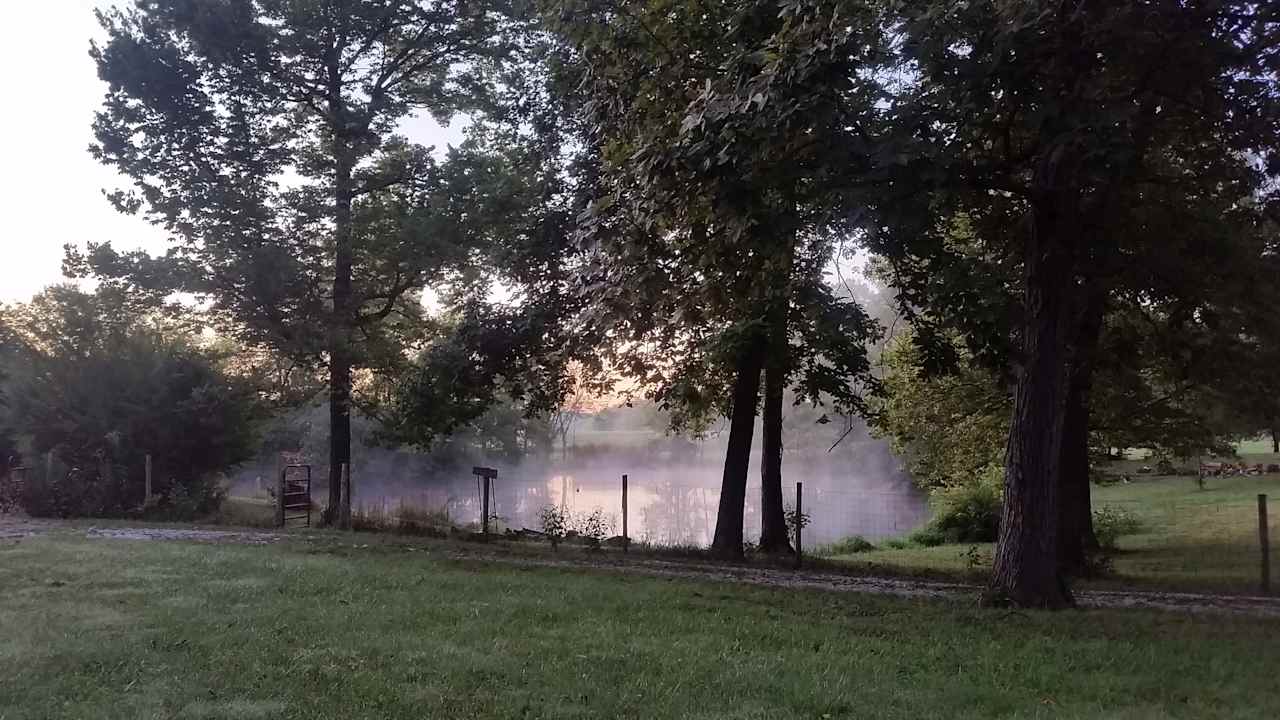 Places to camp in shade around pond provides a beautiful picturesque backdrop for the sunrise. 