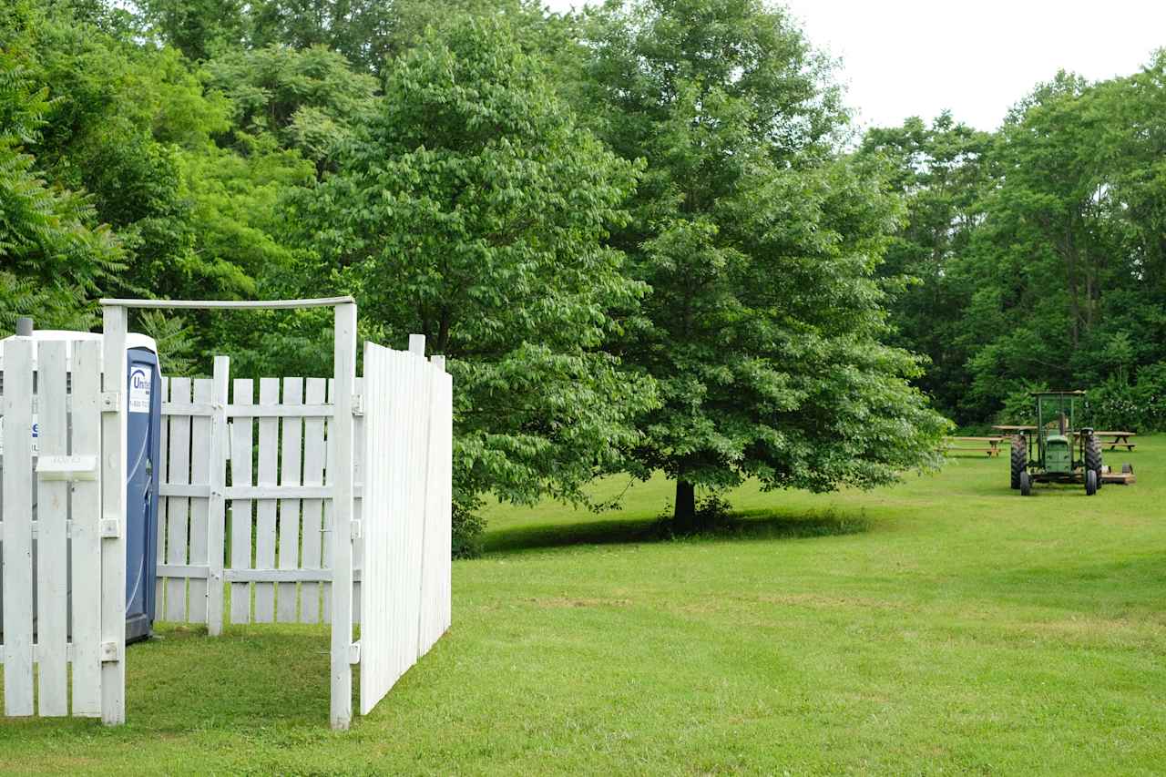 The porta potty here is very clean and the privacy fence around it is a plus!