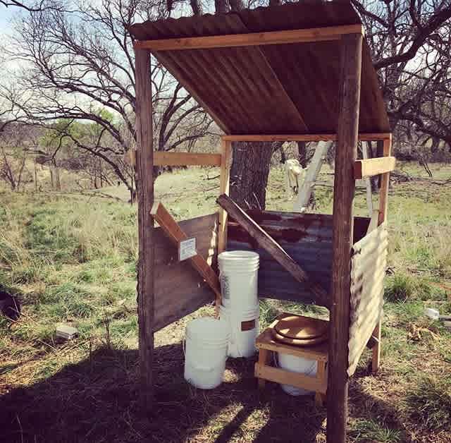 One of two compost toilet "outhouses" in the camping area. Don't worry, it's got a curtain for a door, too. ;)