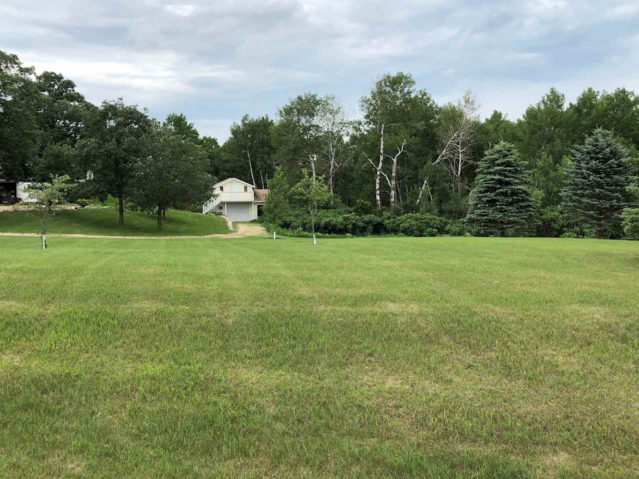 View of the cottage and Hipcamp spot from the road