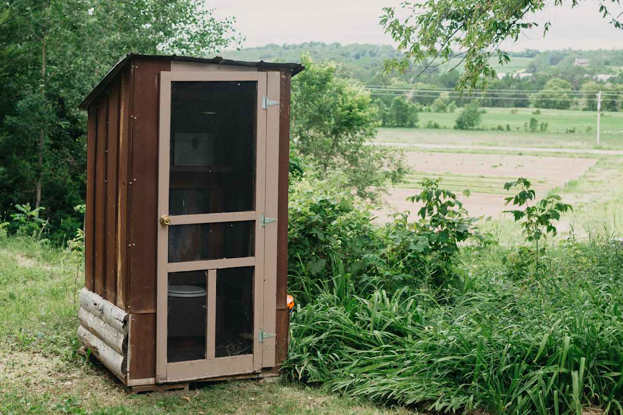 The pit toilet.