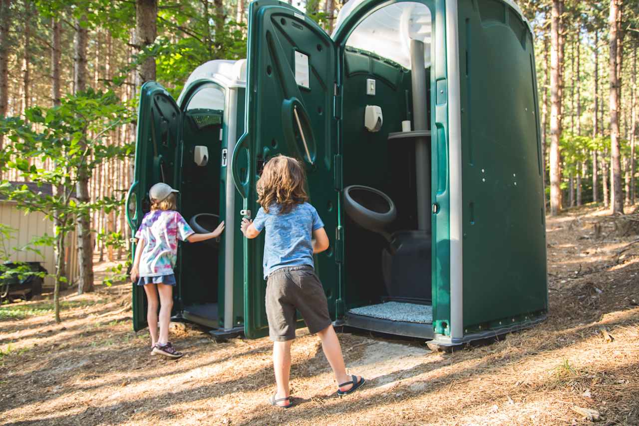 Two portable toilets sit between the kitchen/dining area and the tent sites. They have lights for use at night and are the cleanest portable toilets you'll ever use, complete with a rug that kids found pretty exciting. 