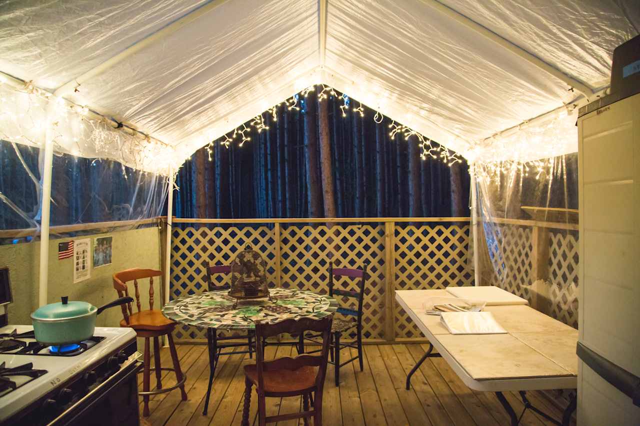 The kitchen is well lit at night.