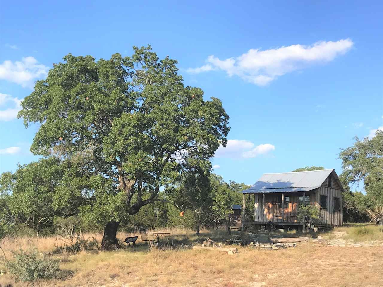 Beautiful evening sunsets to be enjoyed on the front porch which is shaded in the afternoons by a big Spanish Oak.