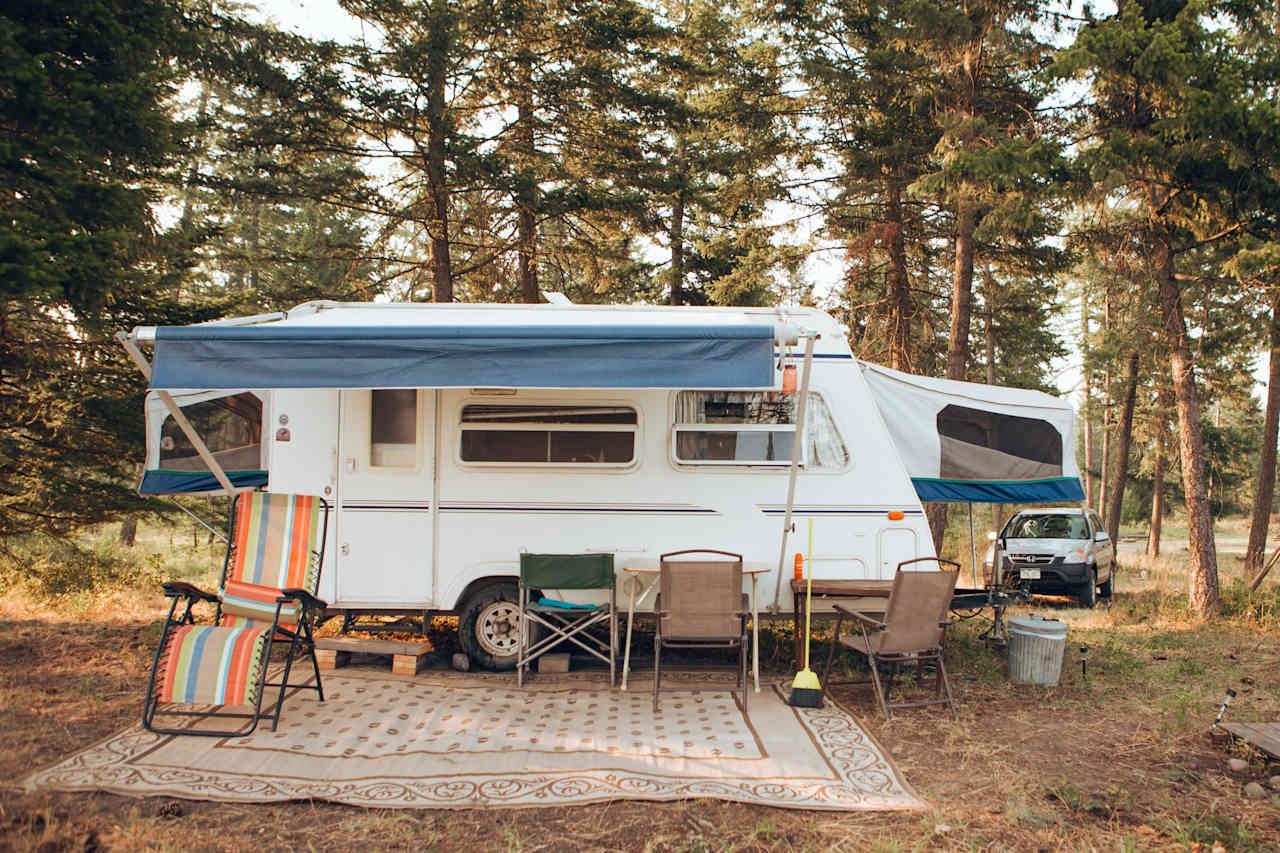 Adorable camper with a nice patio area.