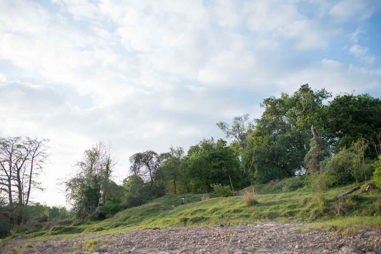 The area around the river is lush and green, with hiking paths leading every way