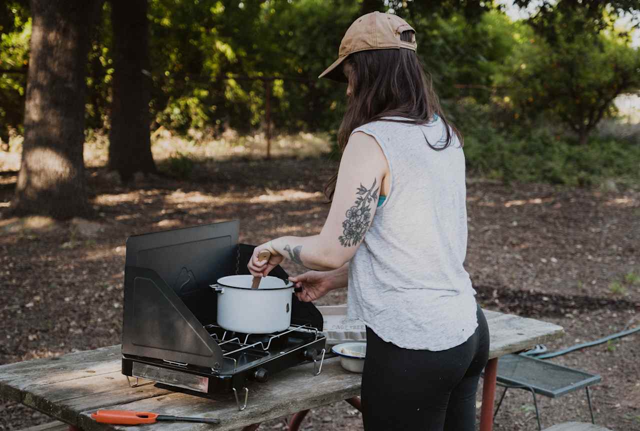 The campsite has a nice big picnic table, a lighter for your stove or fire, and a hose nearby for rinsing off. 