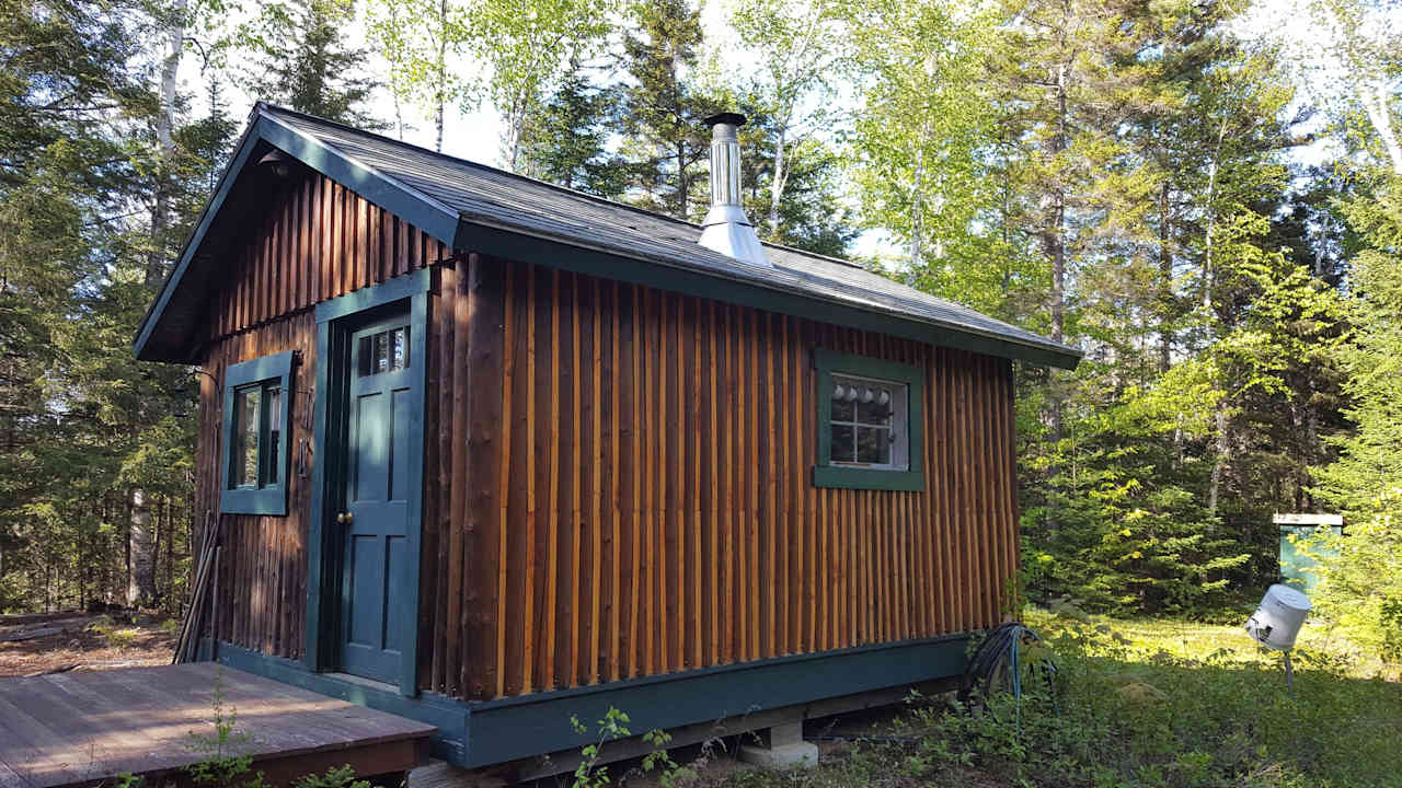 The Moose Moose: 12x16 standing-seam log cabin, sleeps 2 in bunks, has a small kitchen with running water from a frost hydrant, living room, table and chairs, keyed entry, has outdoor fire pit and outhouse. Use of Coleman stove available. 