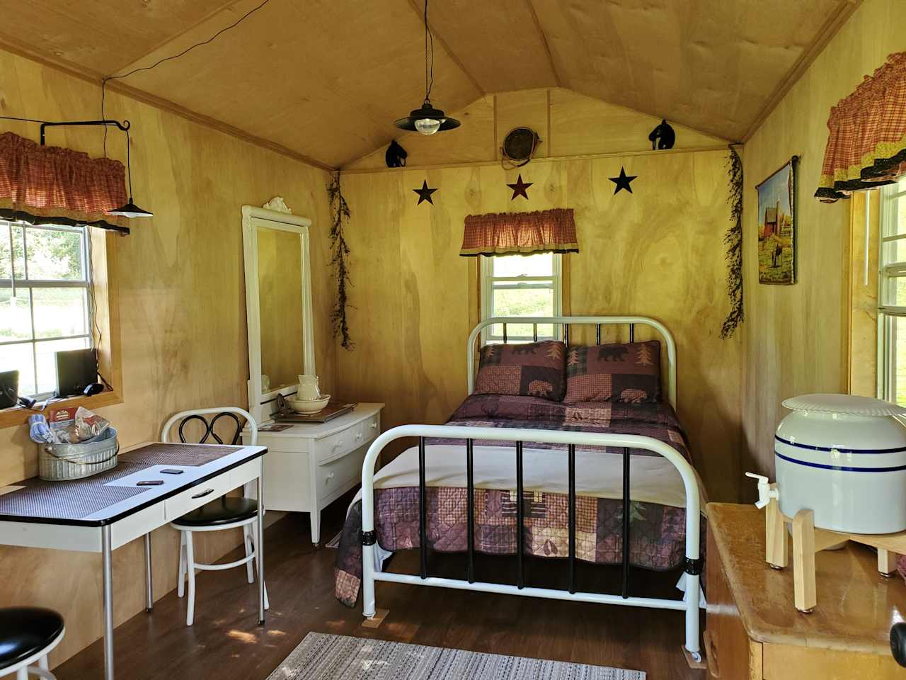 Inside view of Bed, dresser and table