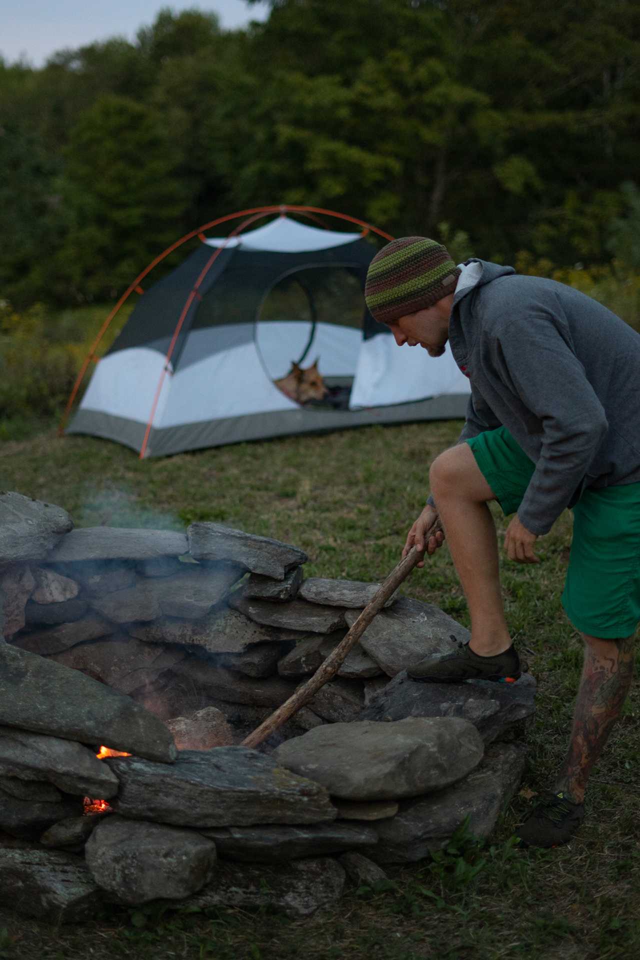 Finn watches as Mike gets the fire started. 