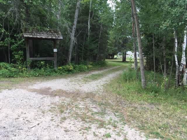 Entrance 27 Wilderness Dr Carp Lake, MI.