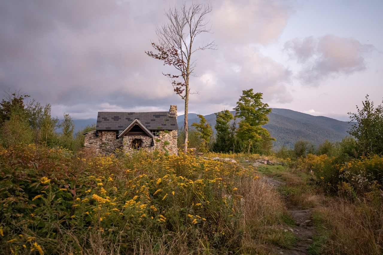 looking back at the cabin from the outhouse trail during sunrise