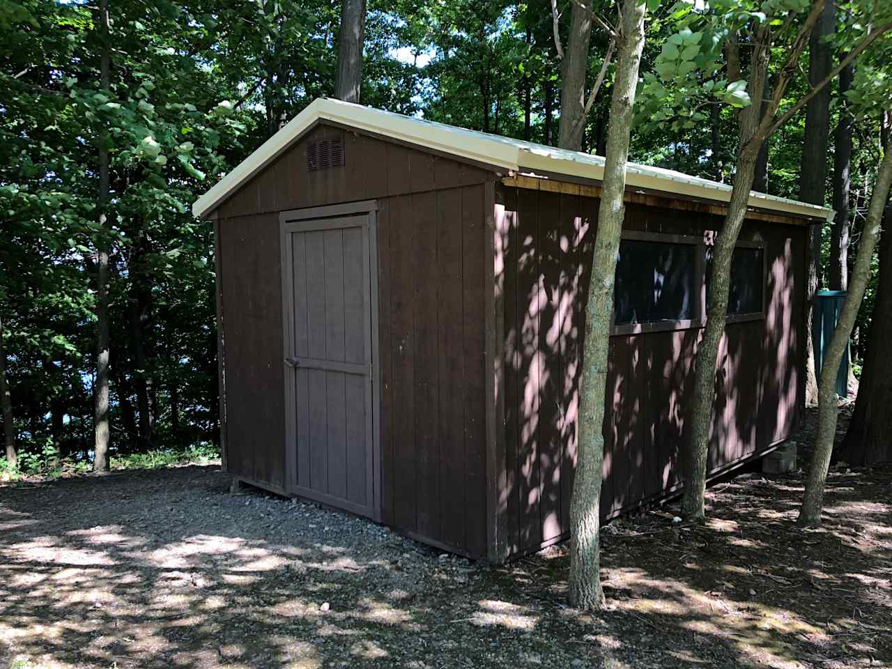 A close-up view of our camper cabins.  4 single beds with cot mattresses are included.