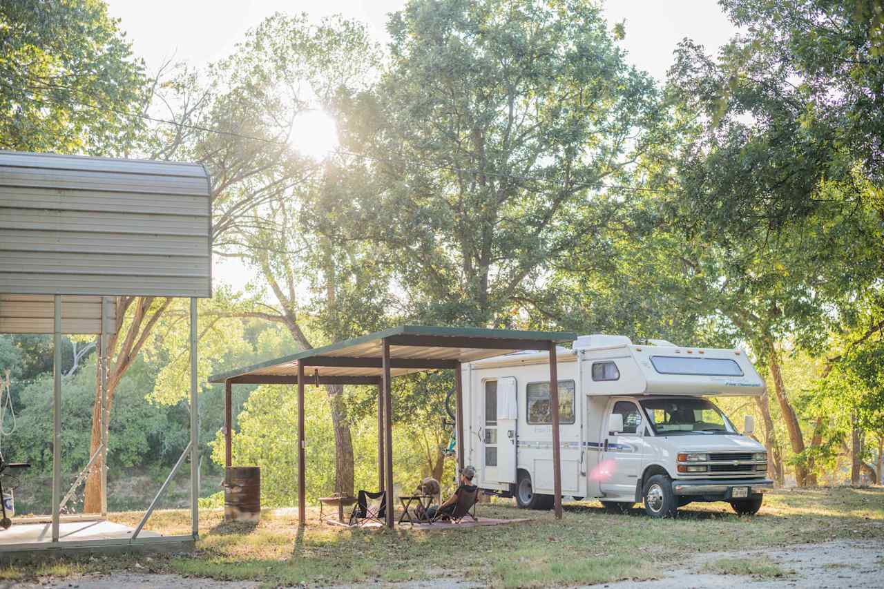 The RV site is level land it was so nice to have a covered picnic pavilion to set up in