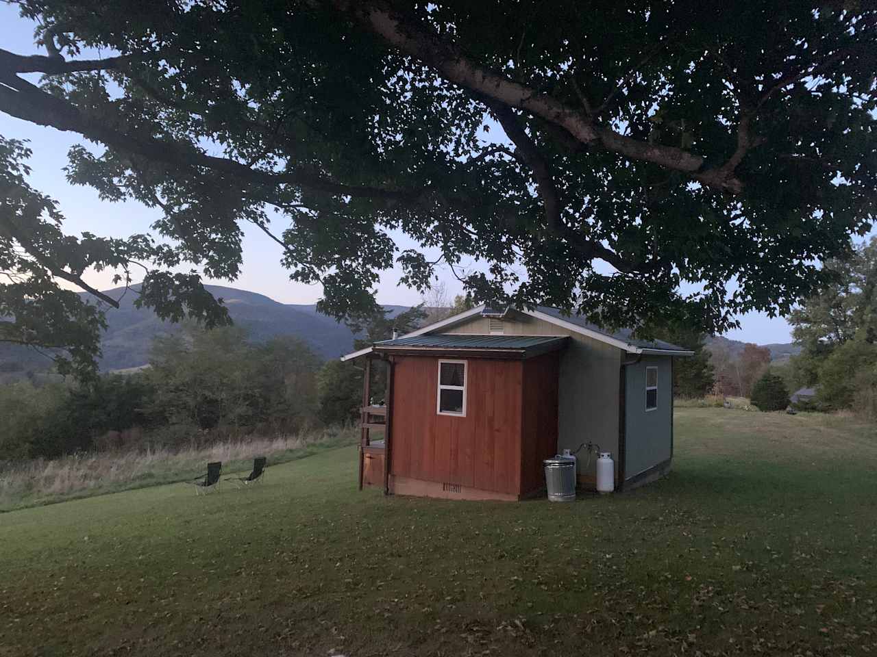 View of the tiny house from the bench/fire pit