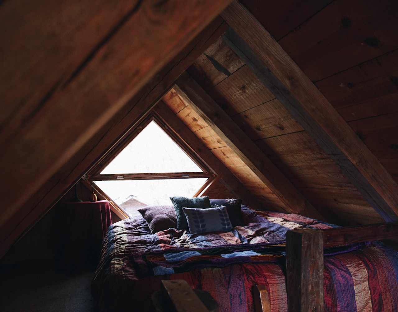 Loft-style bed at Stone Ridge Tiny House