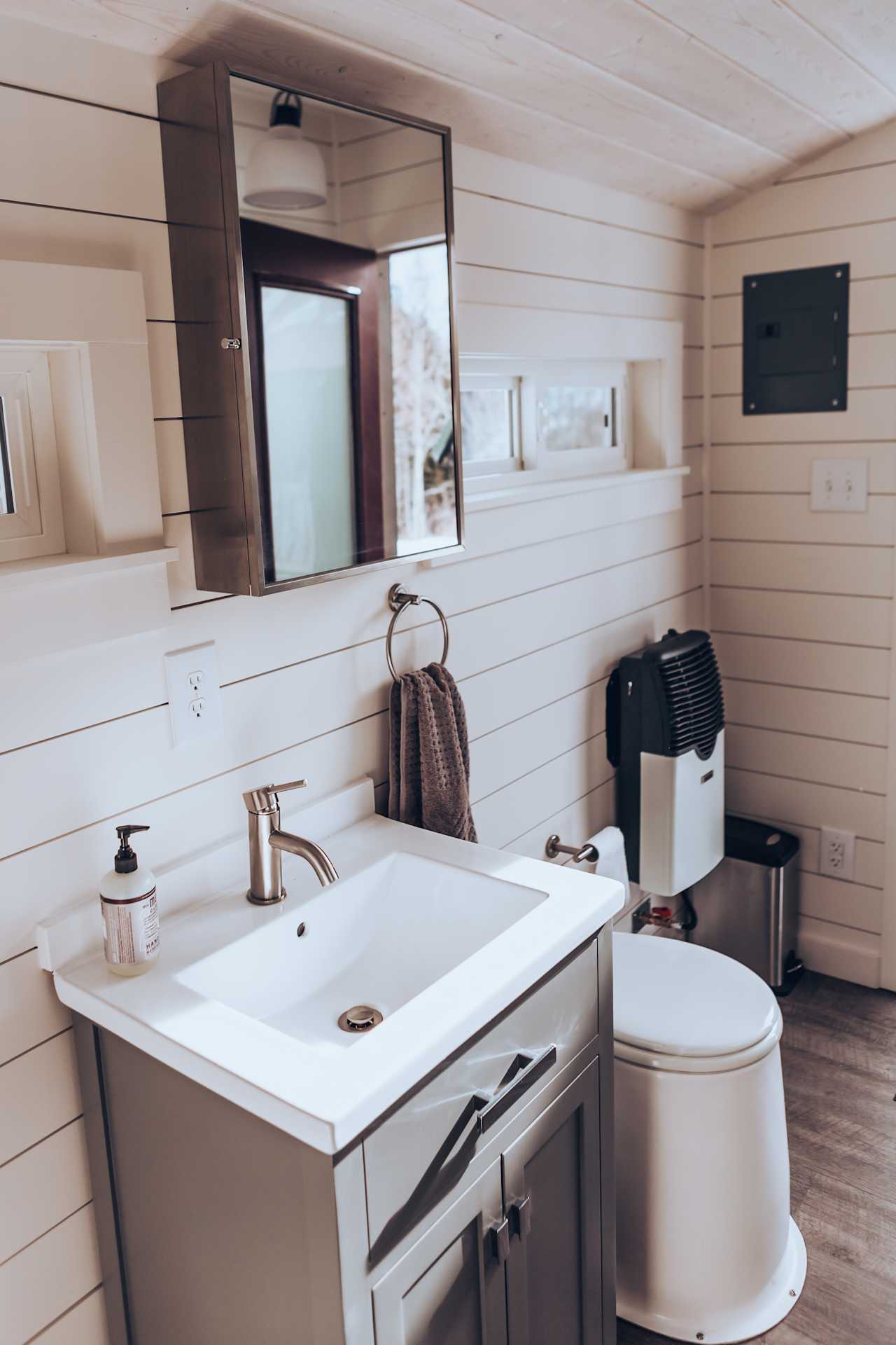 This is the bathroom. It's detached from the yurt, just around the back, and has a toilet, sink (no water unless you bring), and even heating! Very nice and clean.