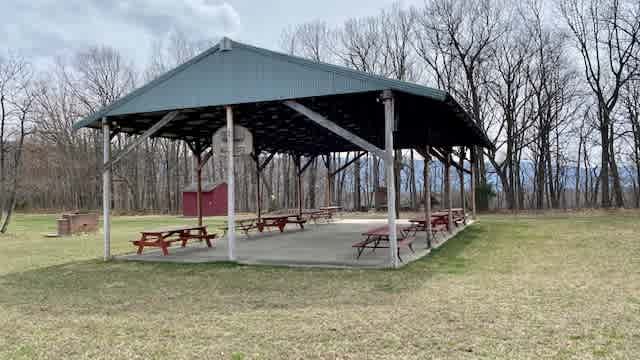 Our covered picnic area includes basketball hoops and seating for up to 50 people!