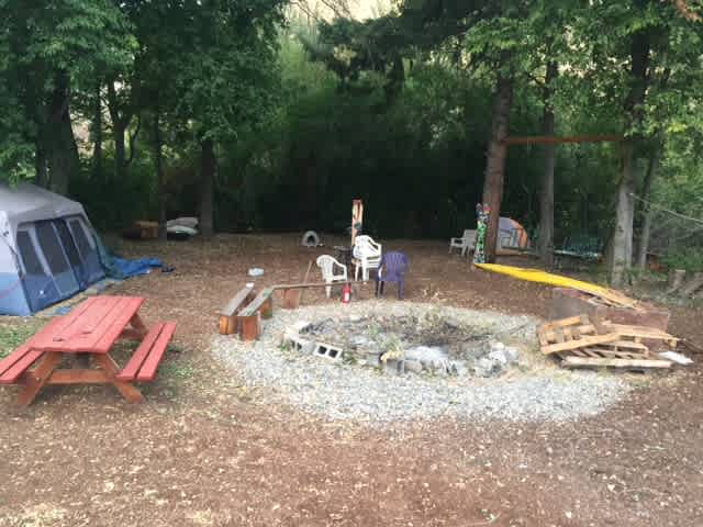 our firepit with camping in the back