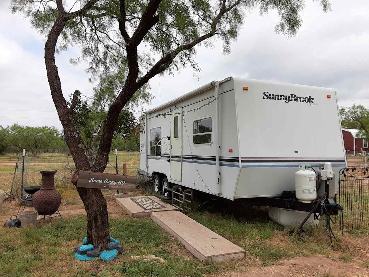 Spacious camper with fenced dog run.