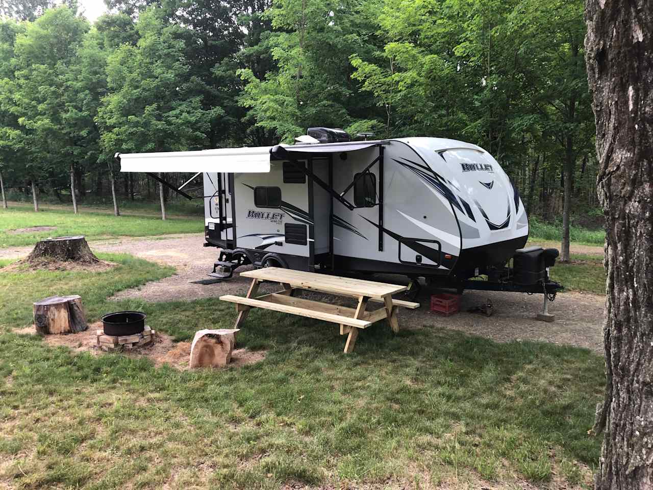 This is camp site #1. It is gravel and level surrounded by mowed grass. The camper is not for rent; it is set up for demonstration purpose