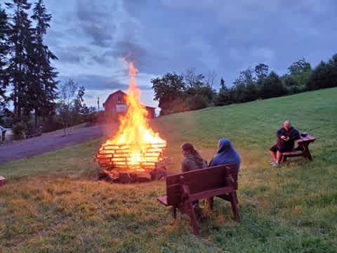 Our community firepit is 6ft across and well away from flammable trees.. We build large fires when the fire danger is low and small fires when the fire danger is high. We are a tree farm so no open fires in campsites please. firewood is provided.