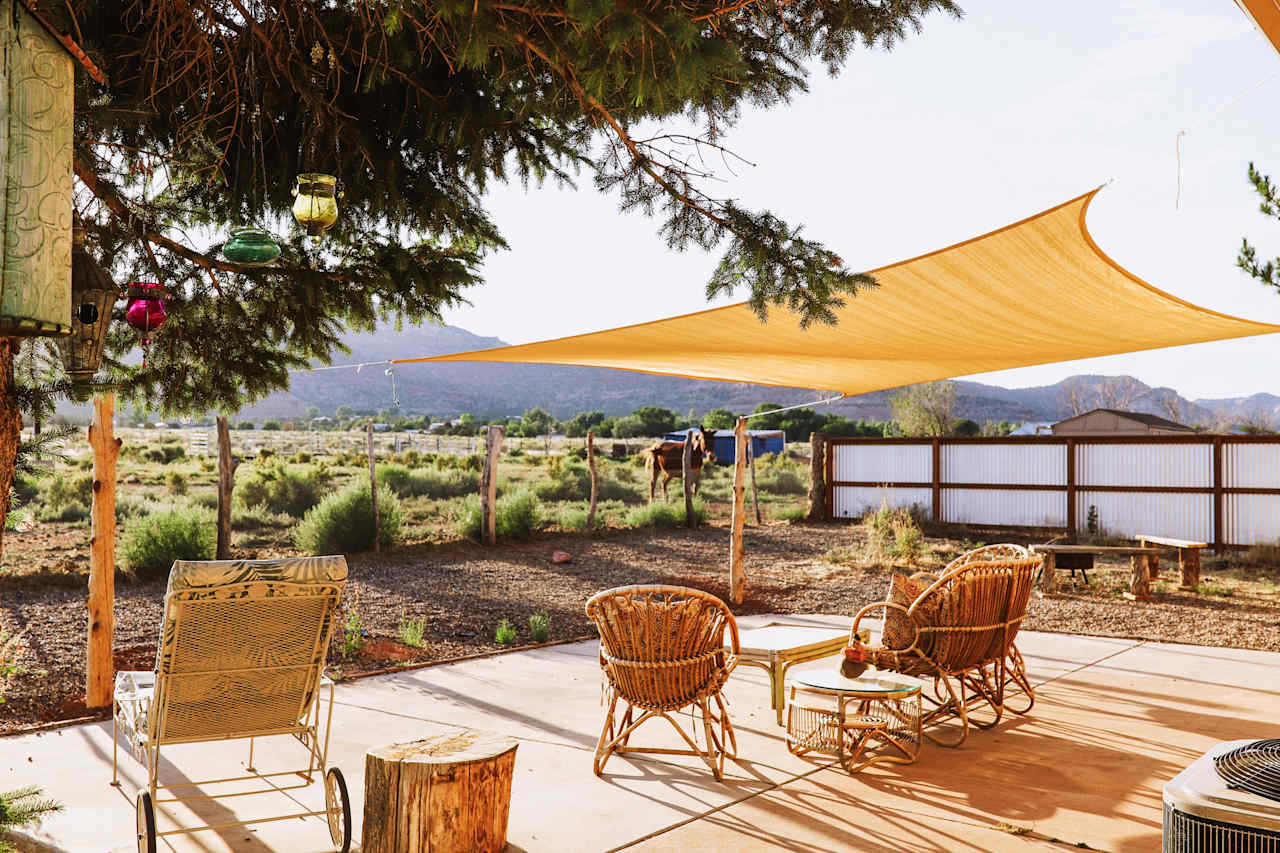 Cozy back porch seating area, perfect for sunset