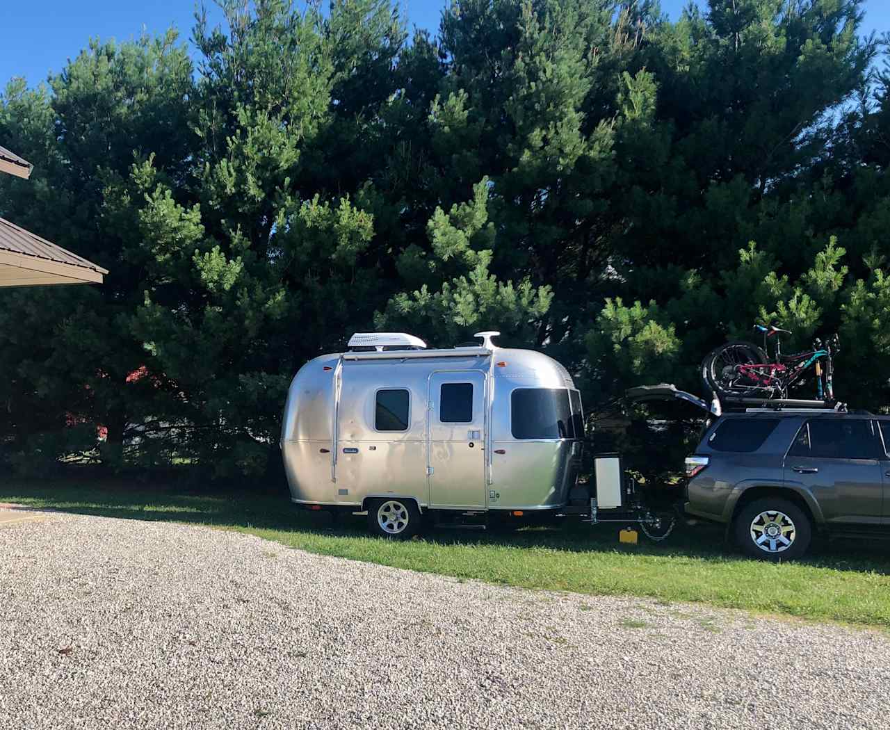 Partially shaded grass parking for smaller RVs and trailers.