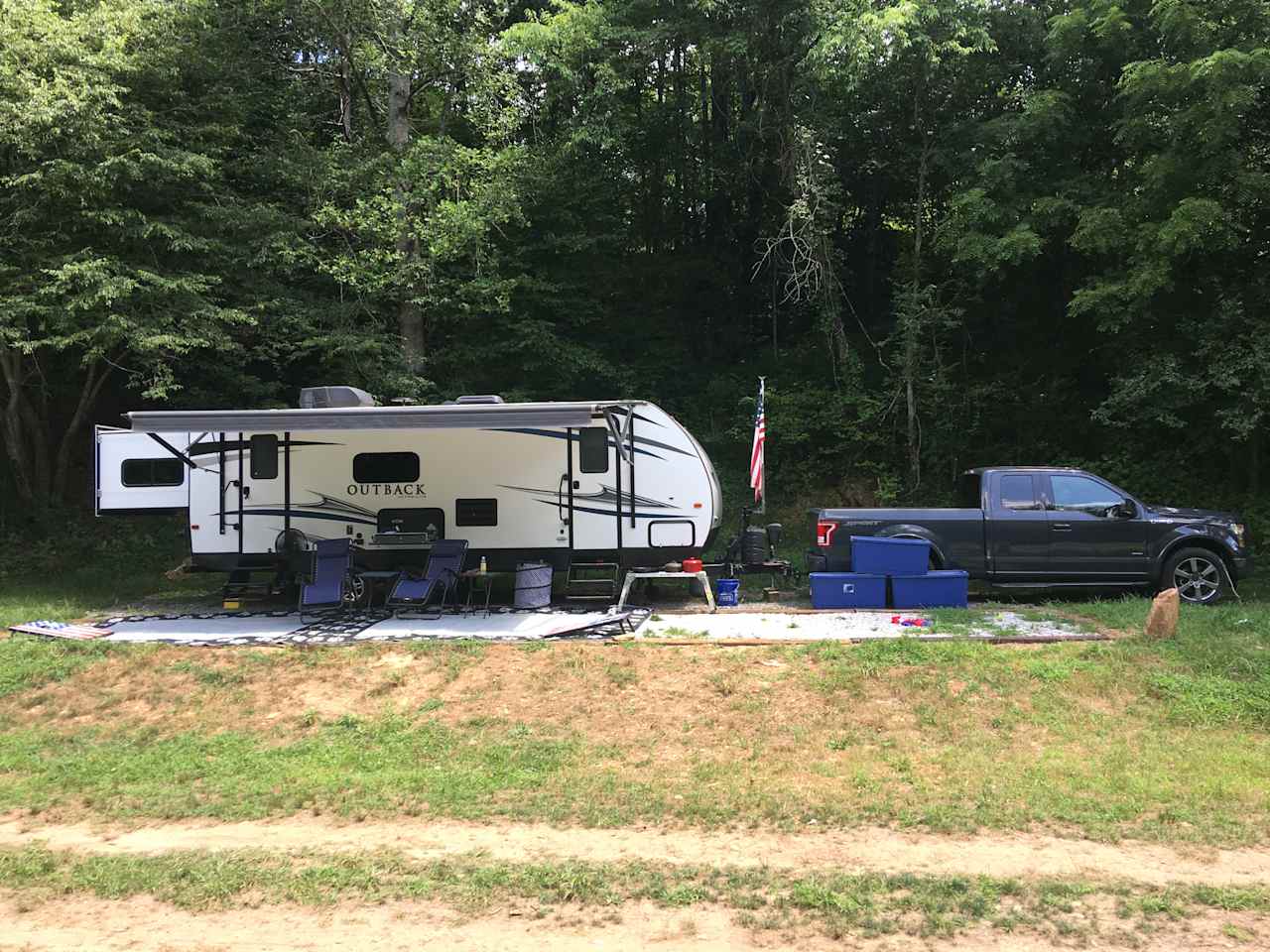 Large gravel site under camper and awing. We are 50 feet with truck and it fit all. 