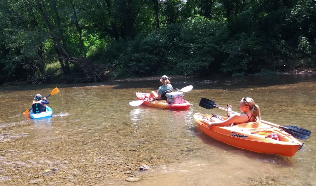 A few kayakers launching out from the day parking area