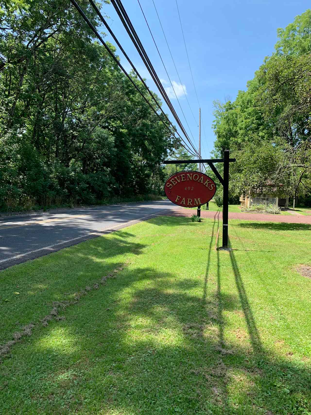 Entrance and property sign for Sevenoaks Farm.