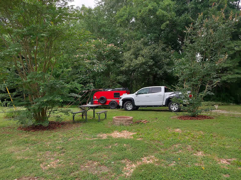 Our campsite was the only one in the open. It was to the left of the house. along the tree line. We had access to well water and were hooked up to 30 amp power. 