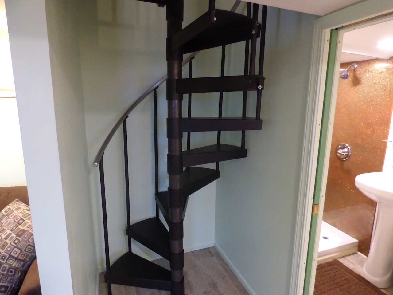 Spiral staircase to bedroom