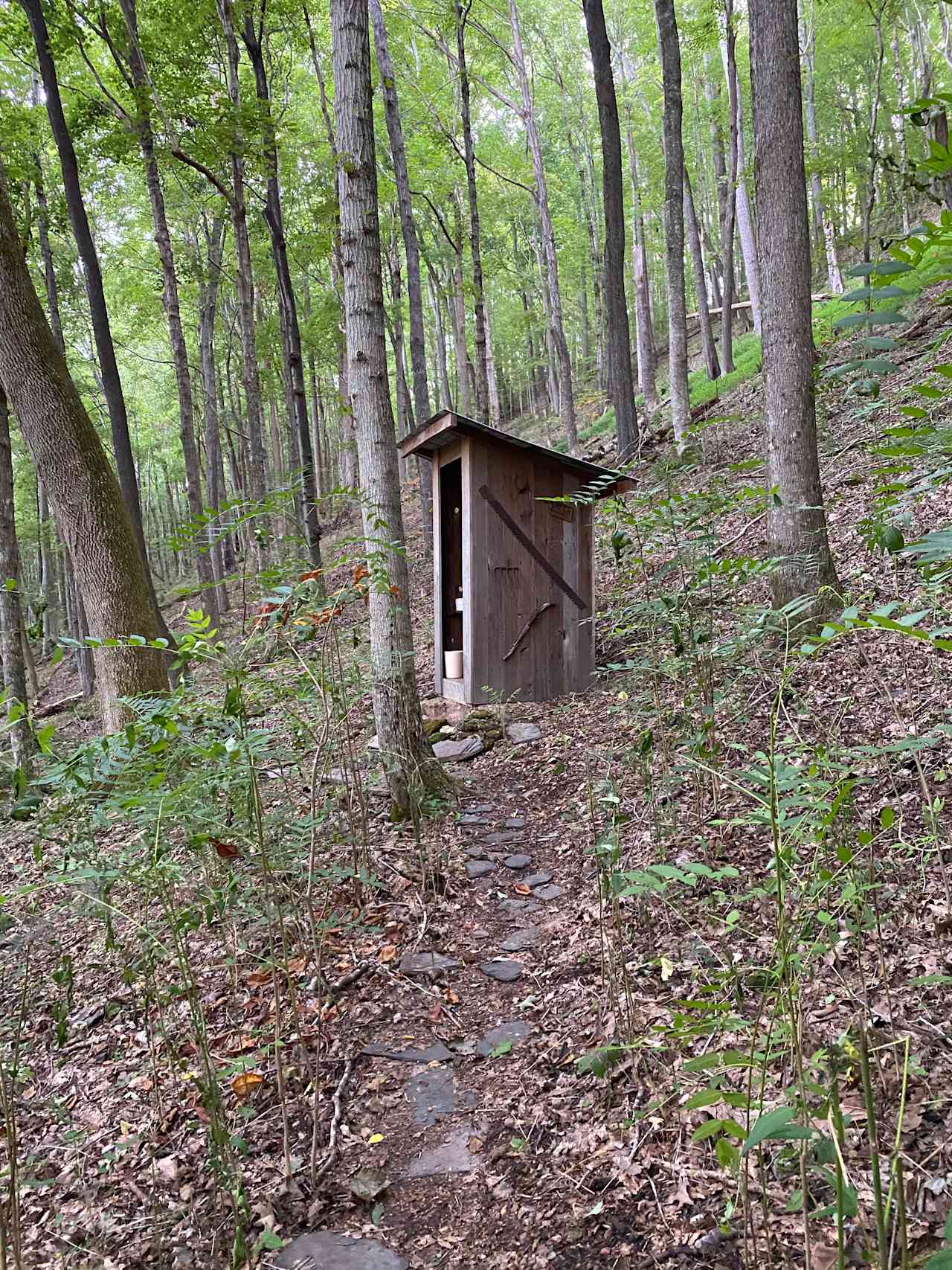 Clean and comfortable outhouse with a lovely view