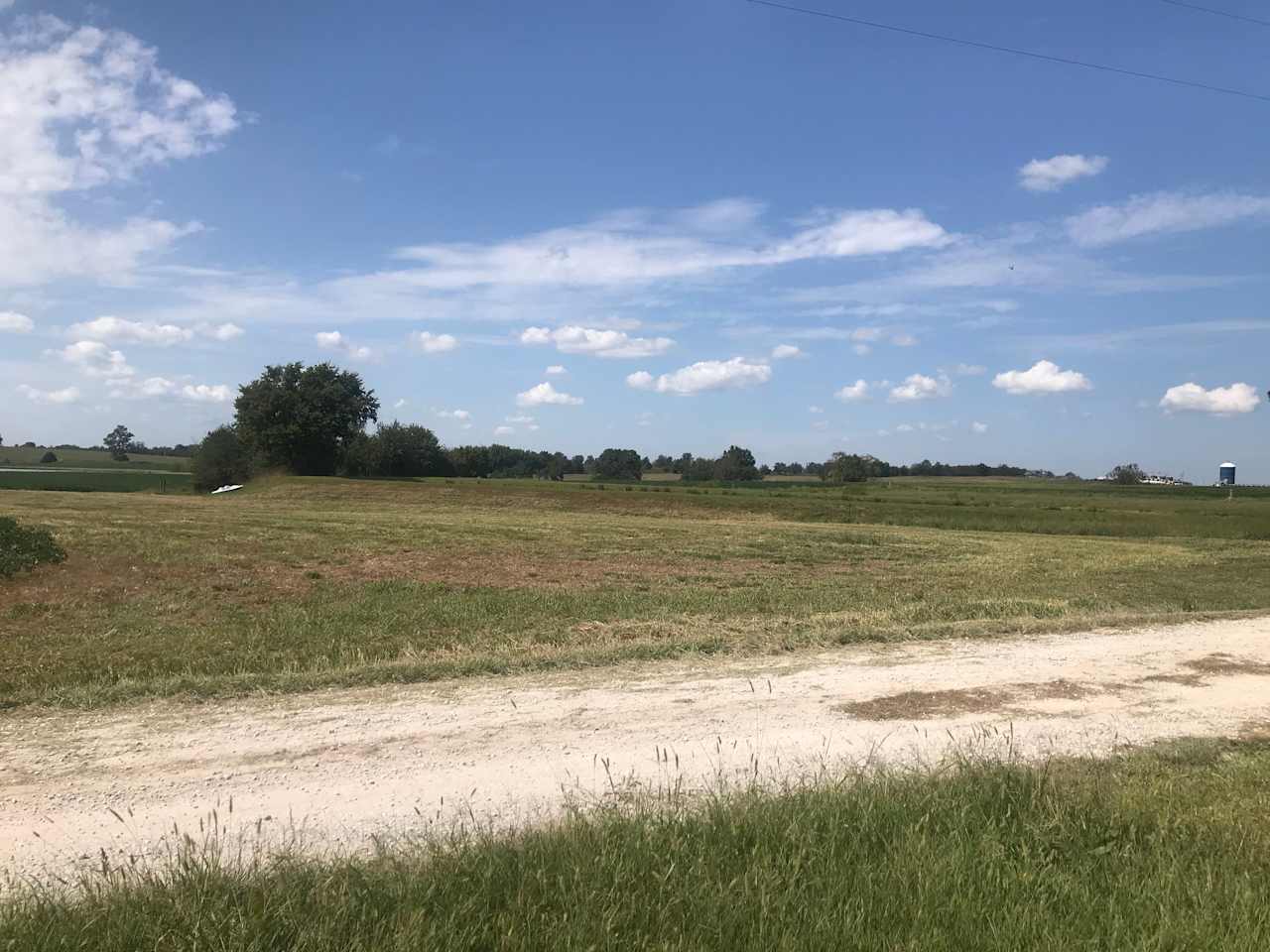 Parking area number 2. Between the driveway and the pond, it's the furthest from the house. It's wide open, no shade, but solid ground, and views to the south and east.