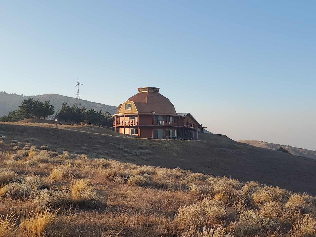 John's beautiful home shining at sunset. I took this on our walk on the trail around his property.