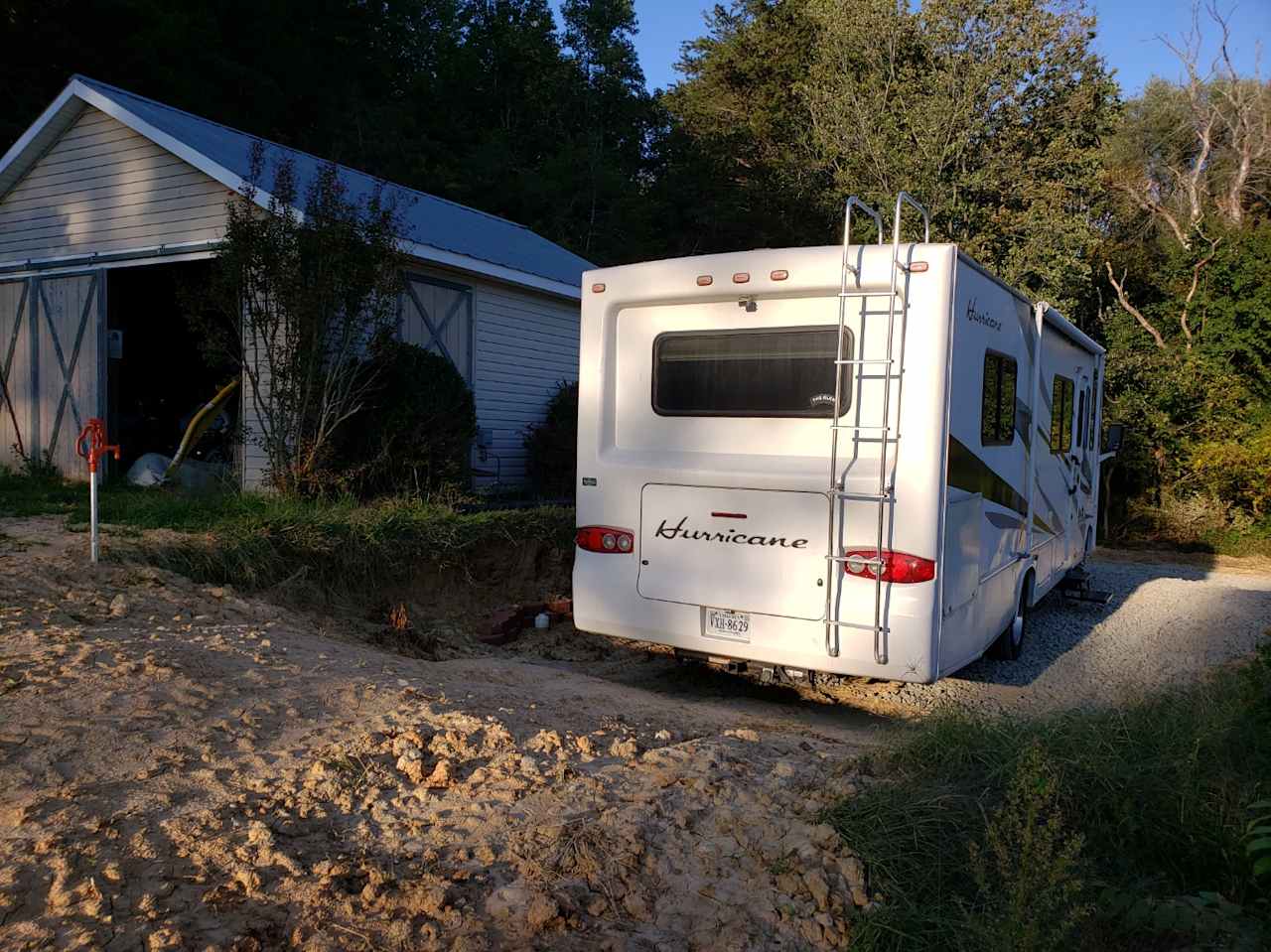 Water, Electric (on shed wall), and sewer are all visible in this view. 