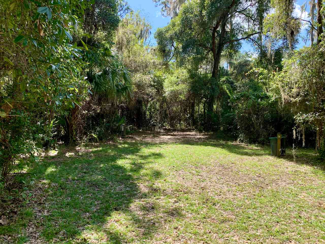 RV Site #5. Accommodates up to 30 ft. RV with water/electric/sewage hookups. Charcoal grill and picnic table.