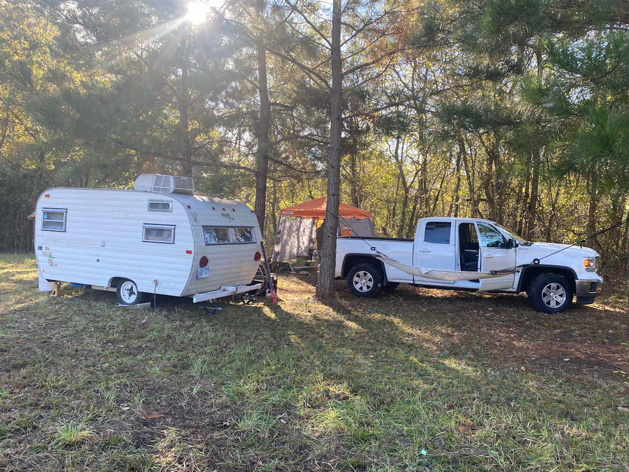 Camp spot next to stream close to river 